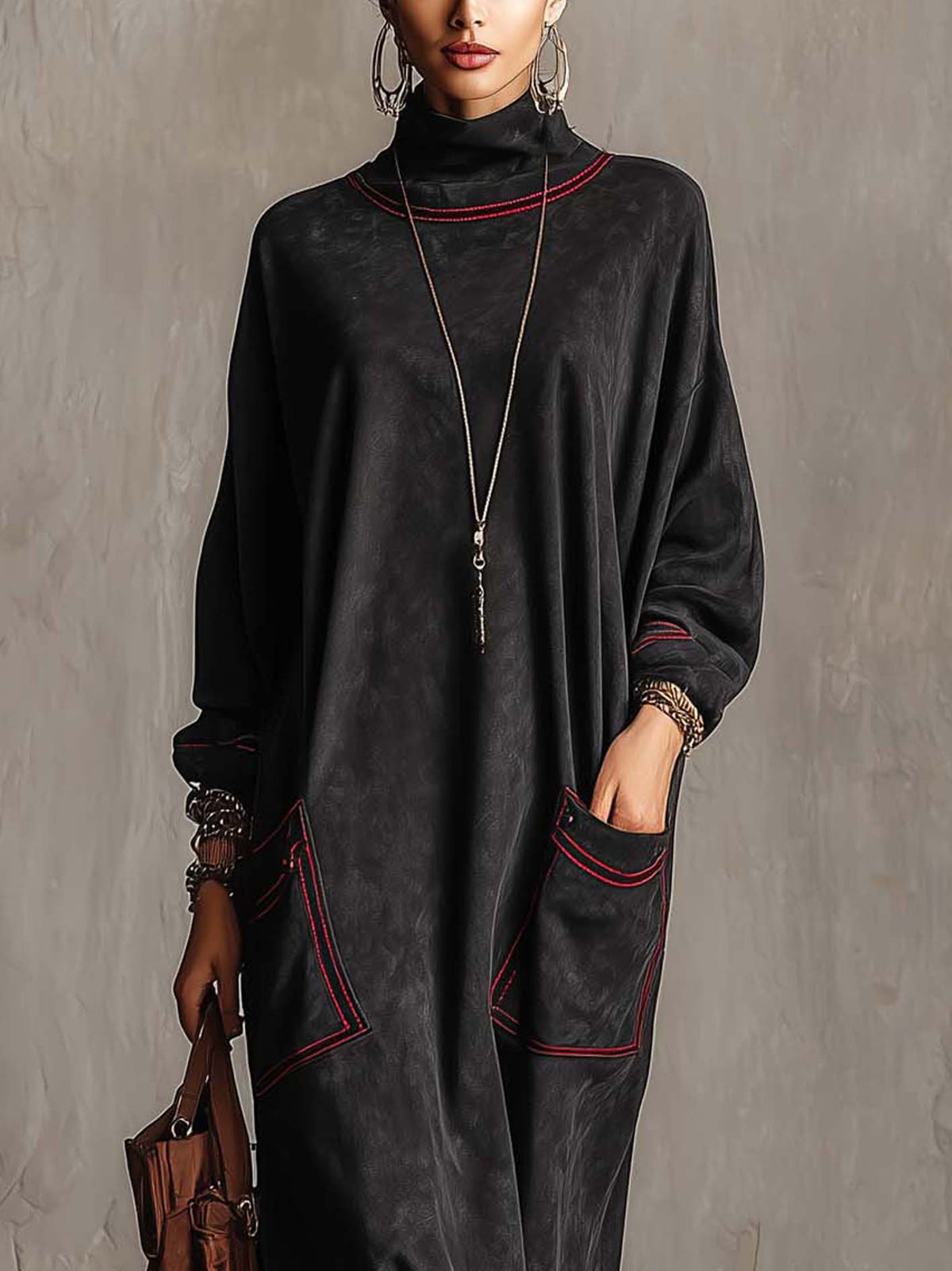 Manuela | Long black synthetic suede dress with contrasting red stitching and patch pockets